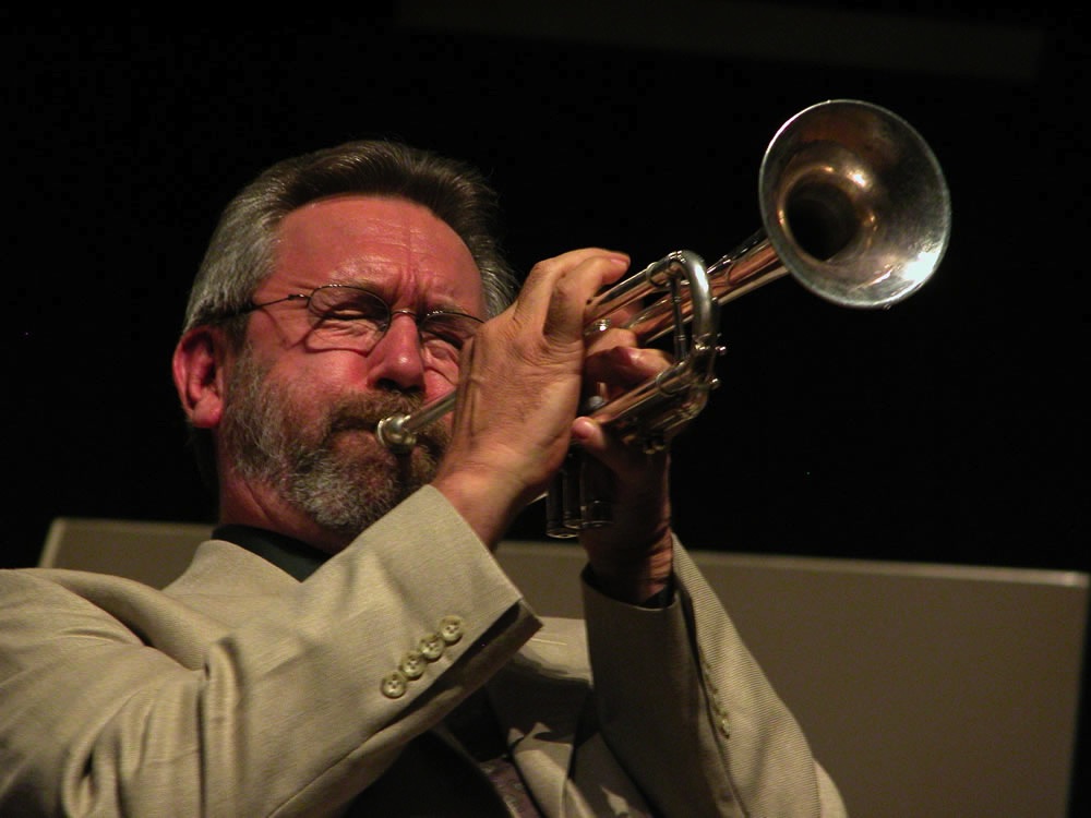 Carl Saunders playing his trumpet in concert.
