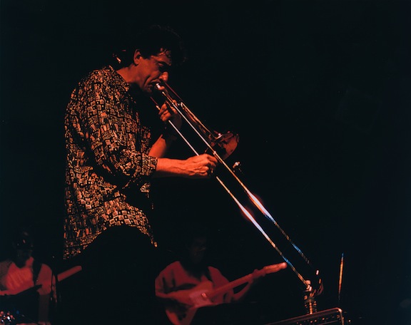 Michael Davis playing his trombone in live concert.